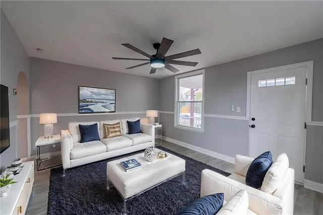 a living room with furniture and a window