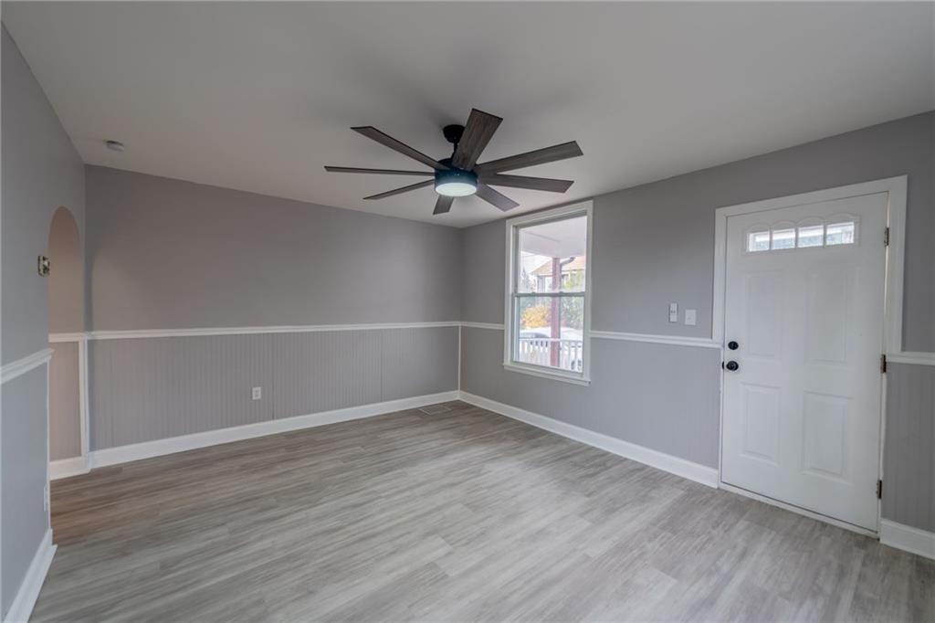 519 Lacock Street Rochester, PA 15074 - Photo 8 of 39 an empty room with wooden floor and windows