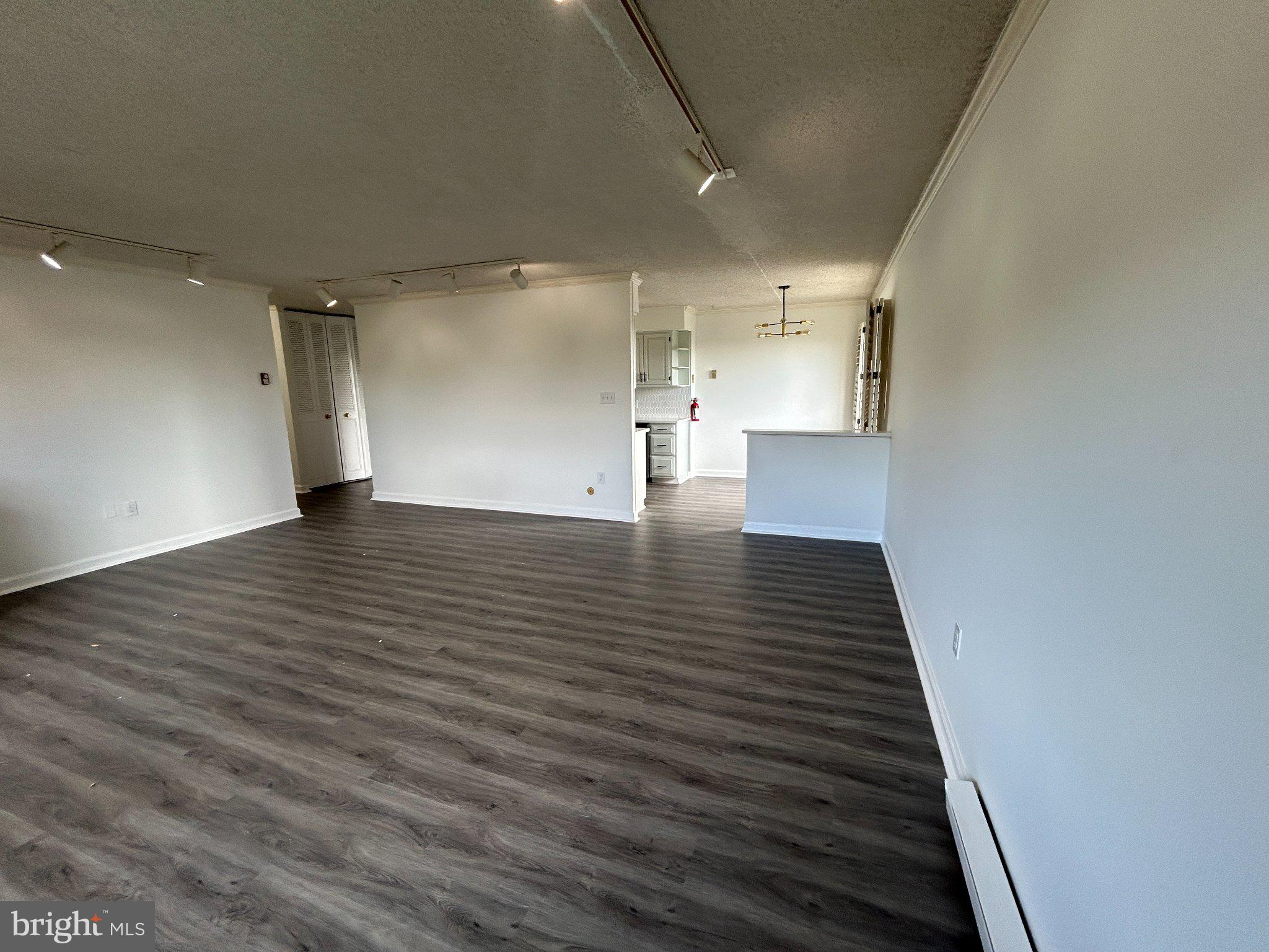 860 Lower Ferry Road, Unit 6M Ewing, NJ 08628 - Photo 10 of 16 a view of a hallway with wooden floor