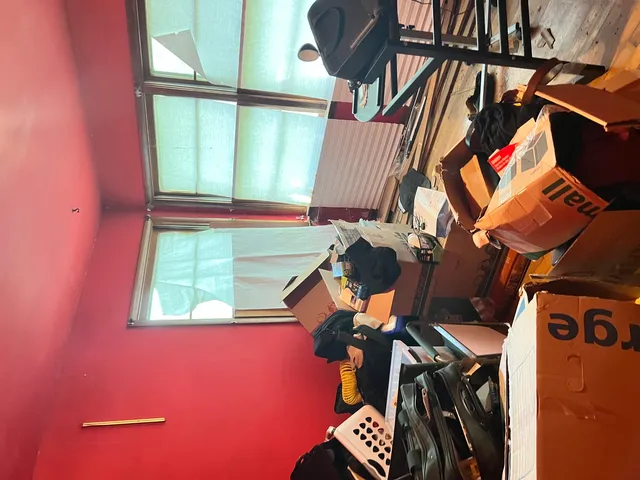 a view of storage and utility room with windows