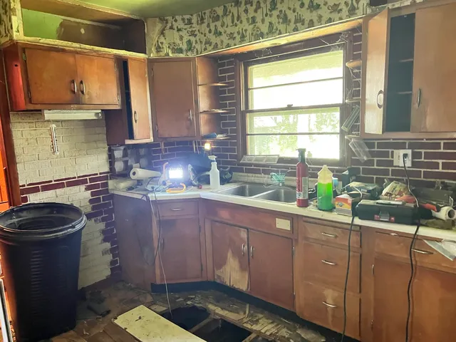 a kitchen with sink and window