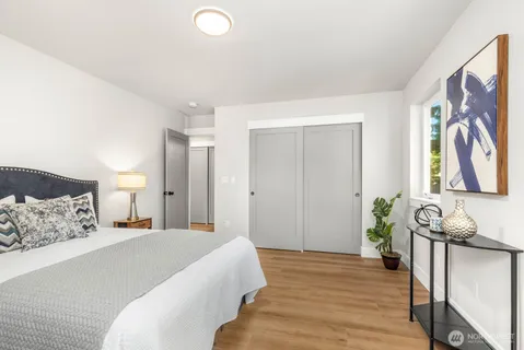 a bedroom with a bed and a couch