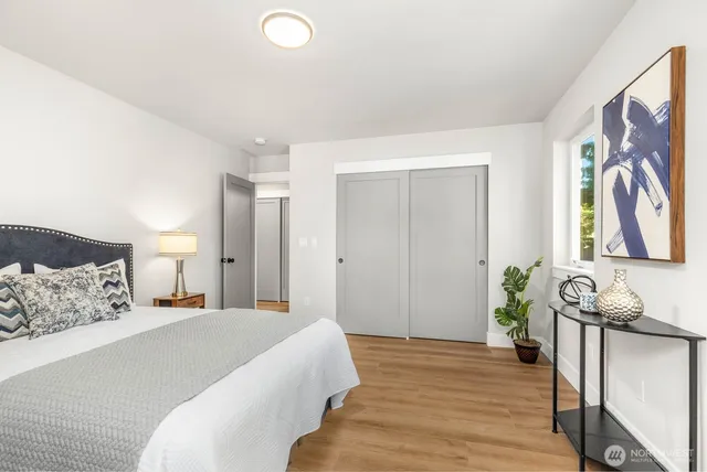 a bedroom with a bed and a couch