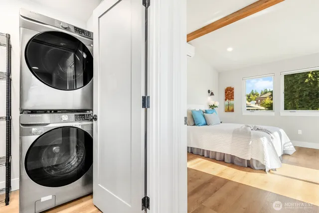 a living room with a washer and dryer