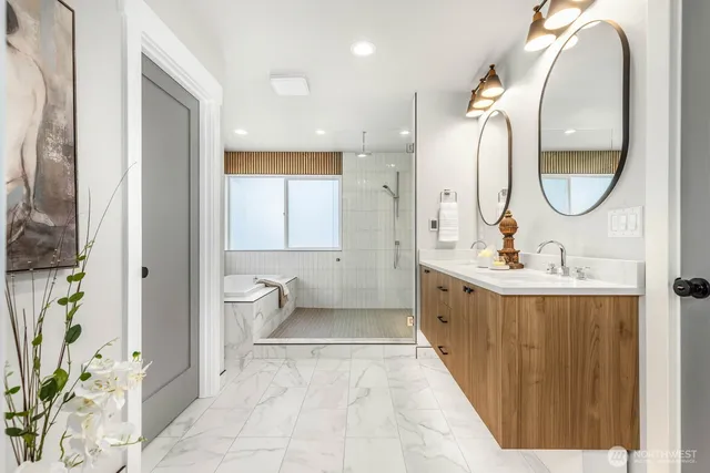 a spacious bathroom with a double vanity sink and a mirror