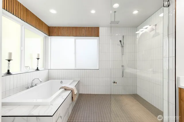 a bathroom with a bathtub and a sink