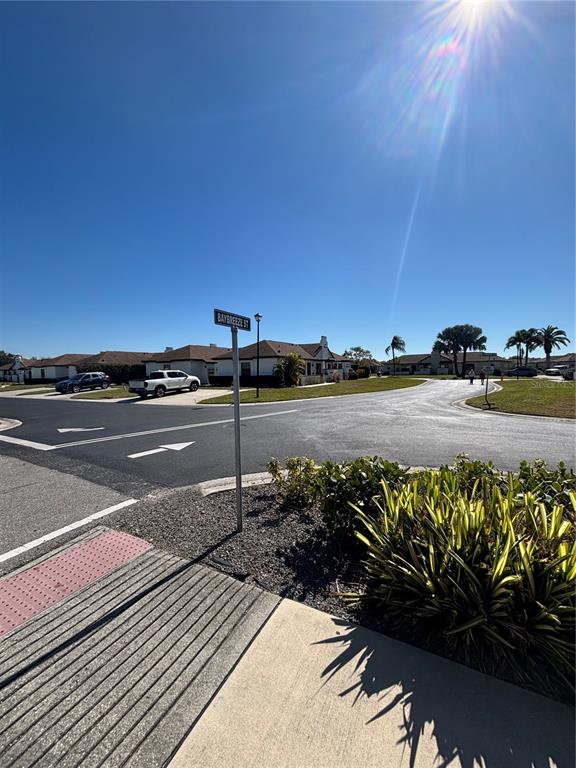 13100 South McCall Road, Unit 111 Port Charlotte, FL 33981 - Photo 2 of 10 a view of a street with an ocean view