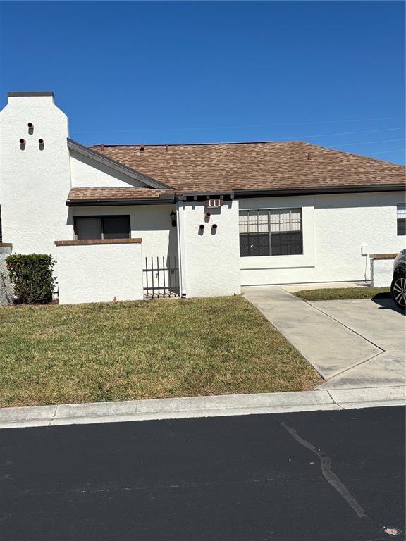 13100 South McCall Road, Unit 111 Port Charlotte, FL 33981 - Photo 3 of 10 a front view of a house with garage