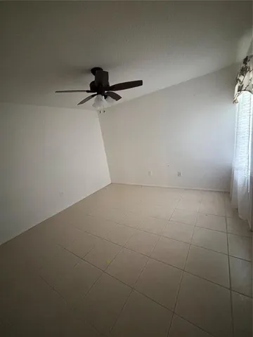 a view of a room with a cabinet and a window