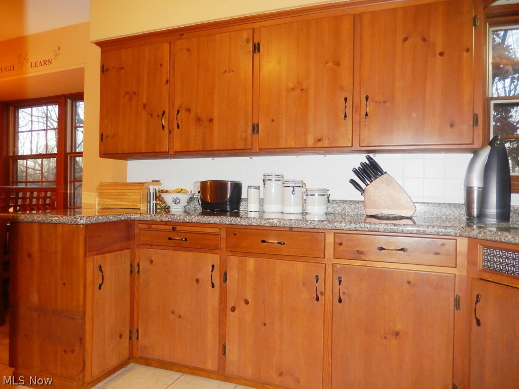 7439 Midland Road Independence, OH 44131 - Photo 5 of 22 Kitchen with Wood Cabinetry, Granite Counters and Tile Floor