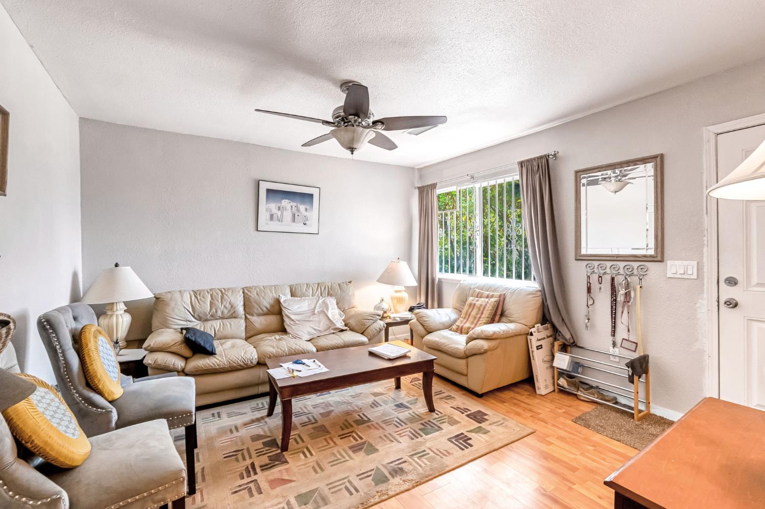 1622 B Street Fresno, CA 93706 - Photo 6 of 32 a living room with furniture a rug and a large window