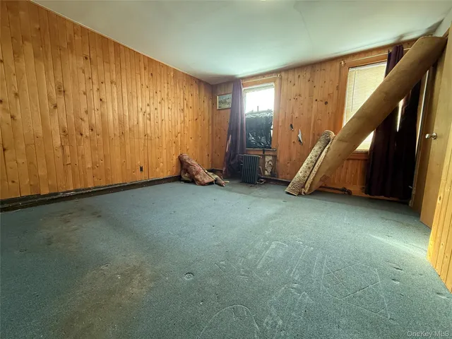 a view of an empty room with stairs