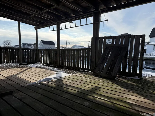 a view of balcony with wooden floor