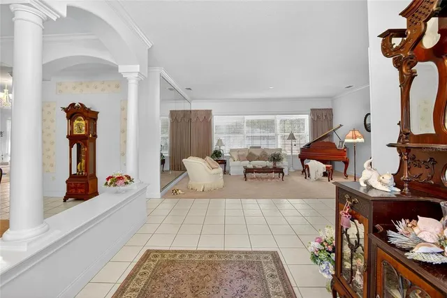 a living room with furniture rug and white walls
