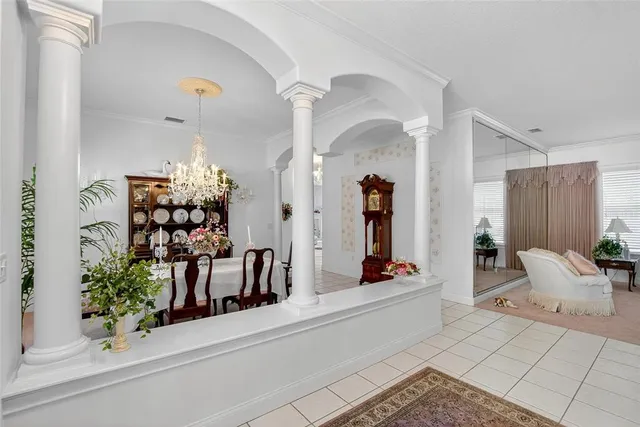 a living room with furniture and flowers
