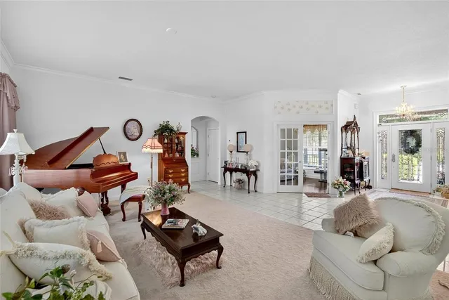 a living room with furniture a air conditioner and a rug