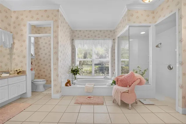 a spacious bathroom with a bathtub and sink