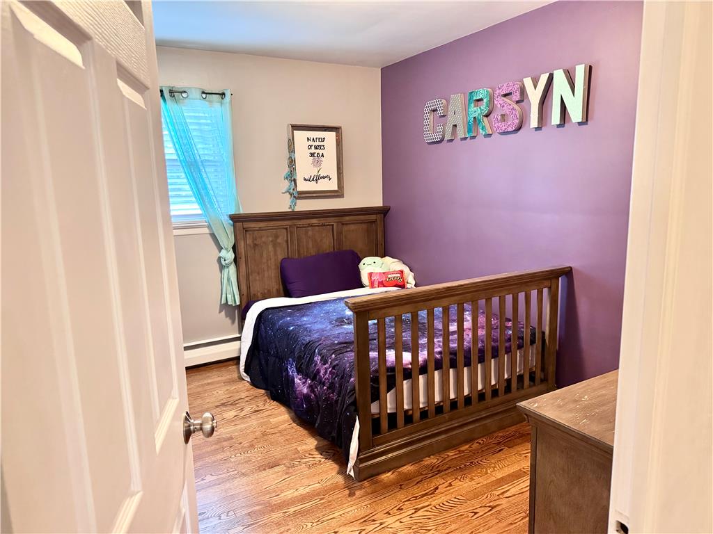 5334 Egypt Road Laurys Station, PA 18059 - Photo 29 of 55 Hardwood floors complement this bedroom's rich wall color and natural light.