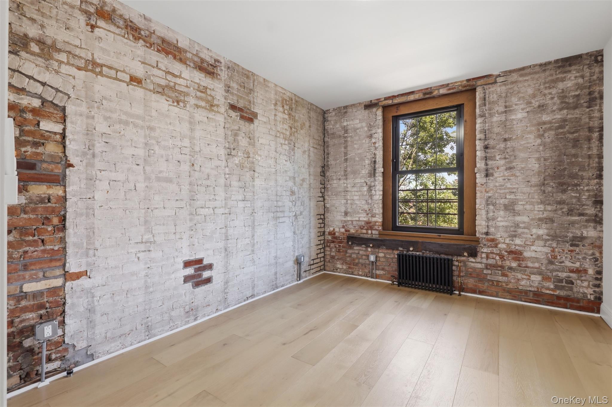 207 Main Street, Unit 3 Beacon, NY 12508 - Photo 7 of 23 a view of an empty room with a window