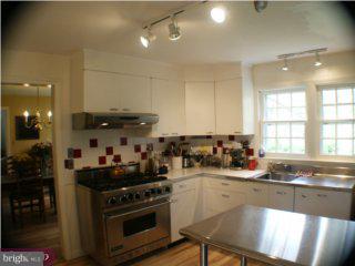 60 Laurel Road Princeton, NJ 08540 - Photo 4 of 6 a kitchen with a stove a sink and a refrigerator