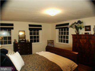 60 Laurel Road Princeton, NJ 08540 - Photo 6 of 6 a bedroom with furniture and windows