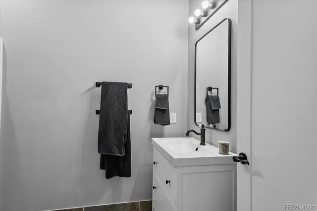 a bathroom with a sink and mirror