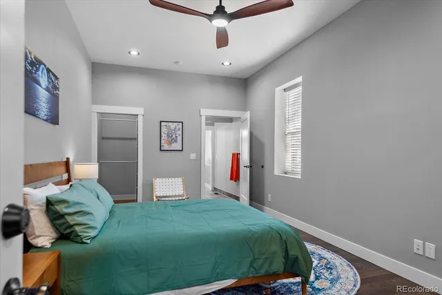 a bed room with a bed and a window