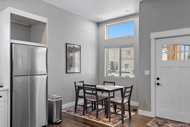 a view of a room with furniture wooden floor and window
