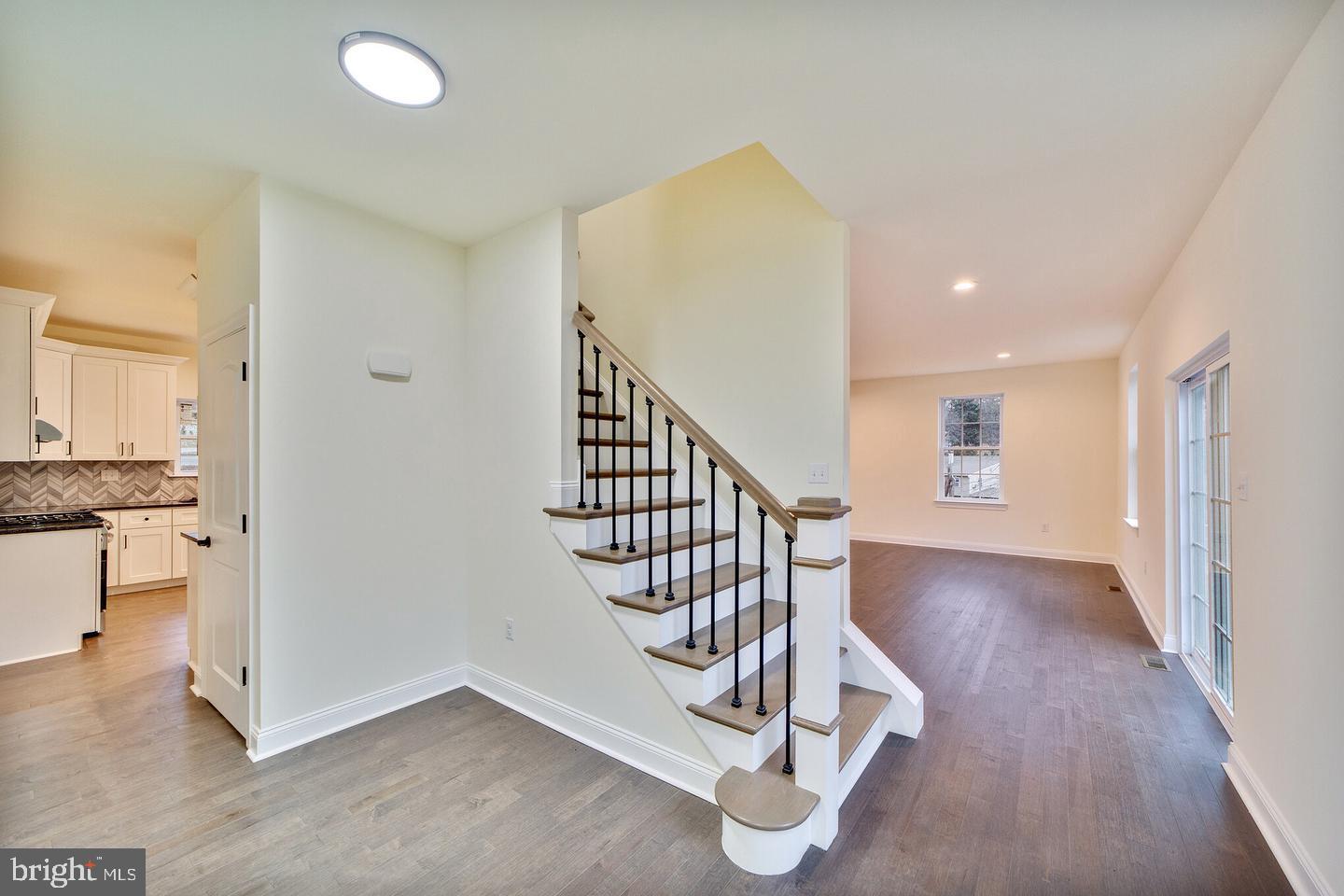 274 Oak Avenue Media, PA 19063 - Photo 15 of 27 a view of a hallway with wooden floor and staircase