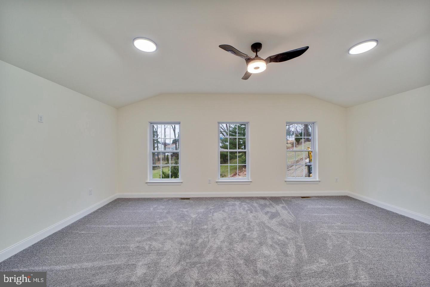 274 Oak Avenue Media, PA 19063 - Photo 17 of 27 an empty room with windows and ceiling fan