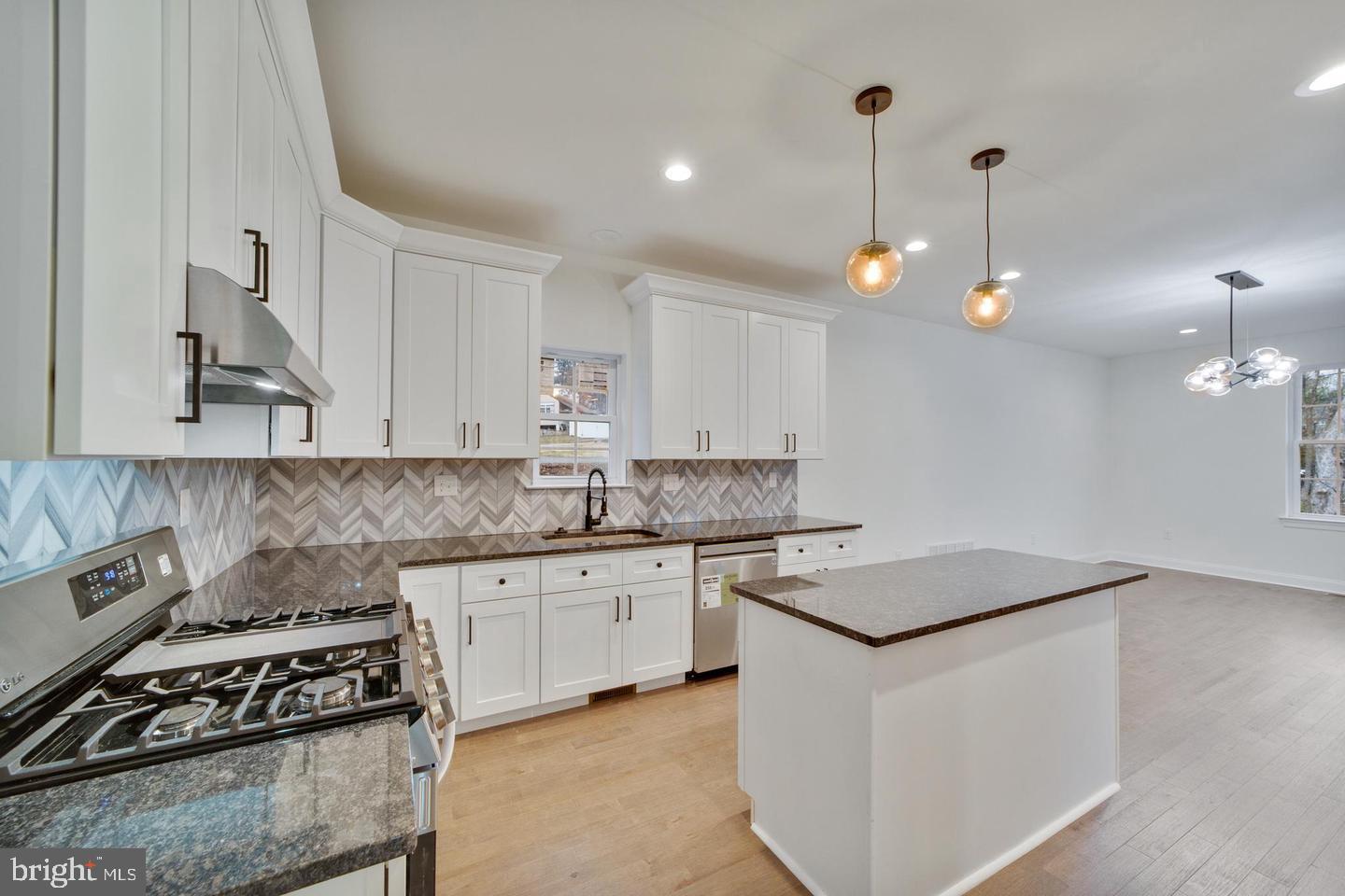 274 Oak Avenue Media, PA 19063 - Photo 8 of 27 a kitchen with granite countertop a sink a stove and cabinets