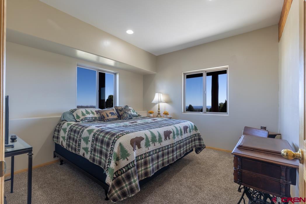1737 Roberts Ridge Drive Hesperus, CO 81326 - Photo 20 of 34 a bedroom with a bed and a desk
