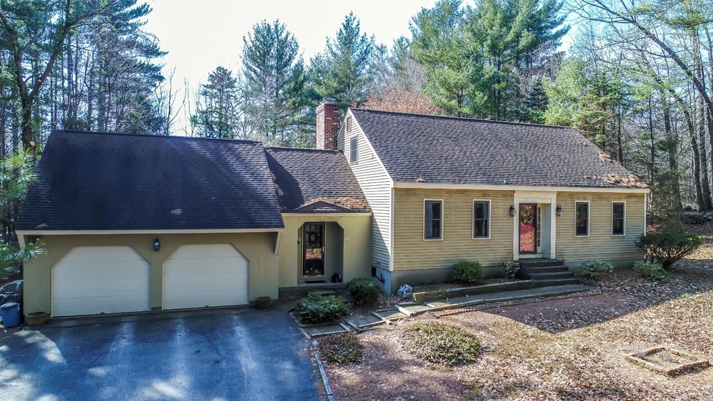 23 Country Road Lunenburg, MA 01462 - Photo 1 of 21 a view of a small house in front of a yard with plants and large tree