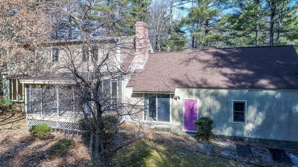 23 Country Road Lunenburg, MA 01462 - Photo 20 of 21 a front view of house with yard and trees in the background