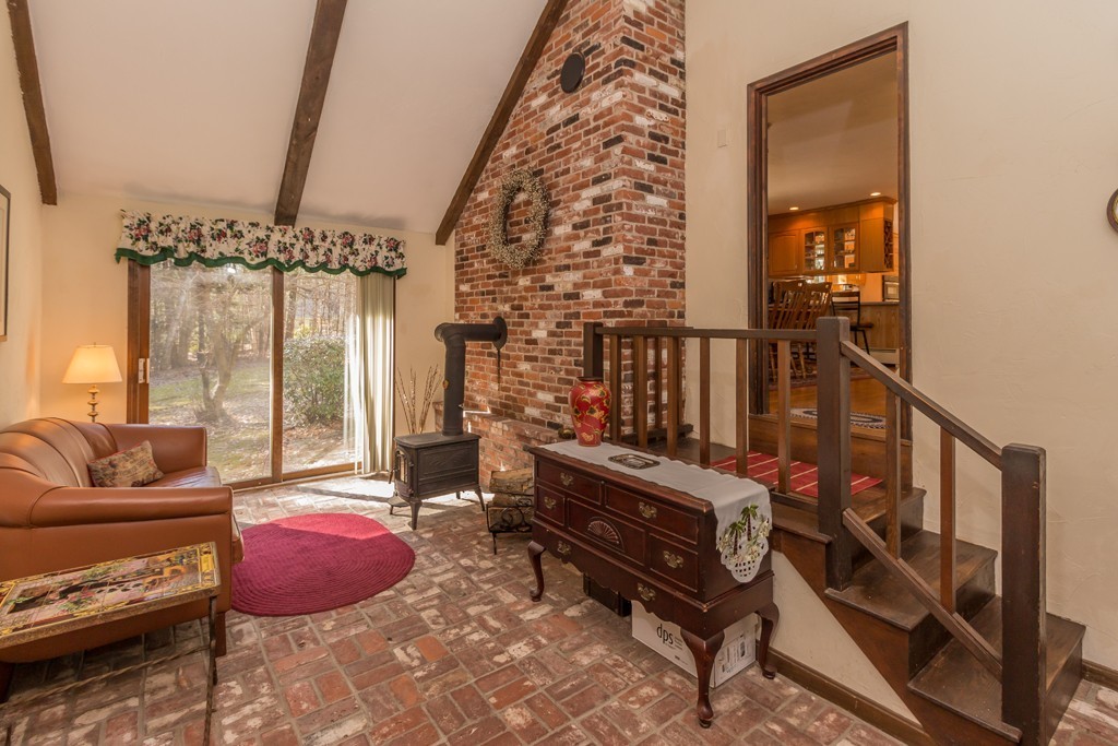 23 Country Road Lunenburg, MA 01462 - Photo 2 of 21 a living room with furniture and a chandelier
