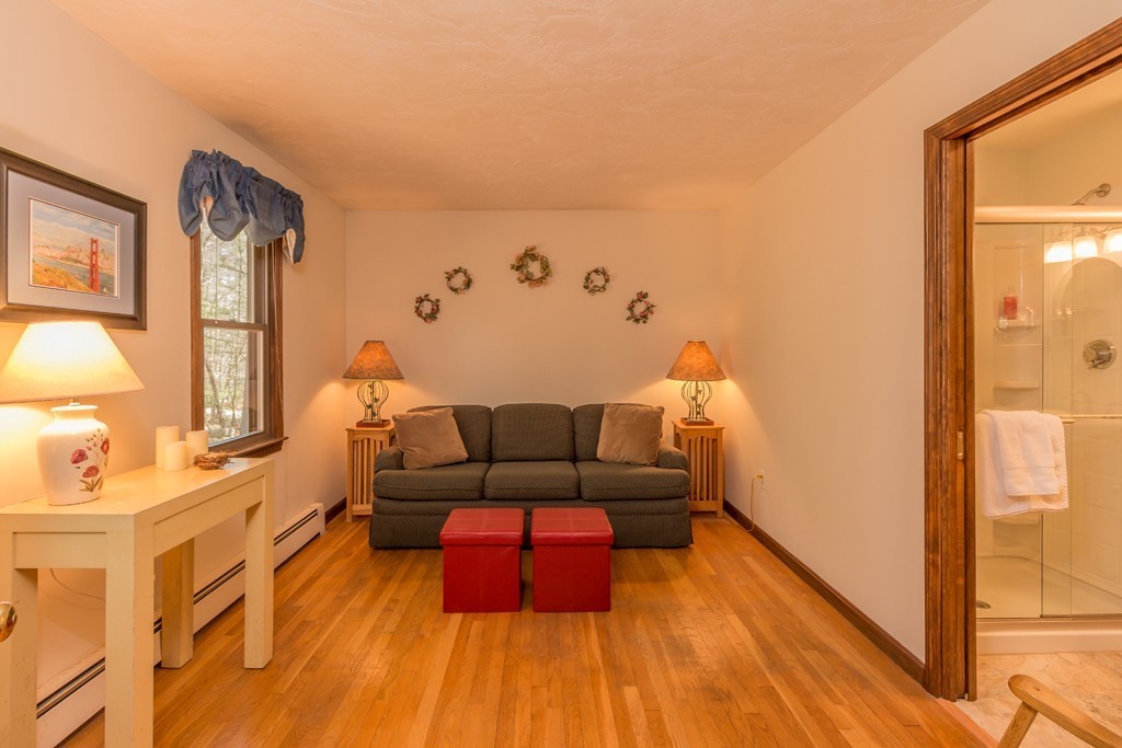 23 Country Road Lunenburg, MA 01462 - Photo 10 of 21 a living room with furniture and wooden floor