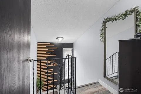 a view of entryway with wooden floor