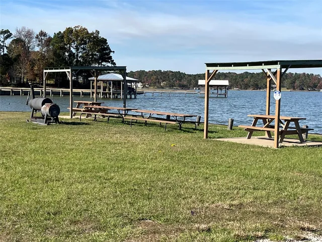 a view of a swimming pool with lawn chairs