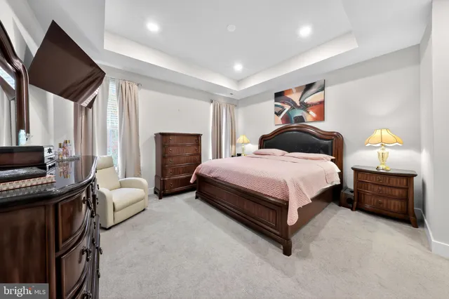 a bedroom with a bed and a couch