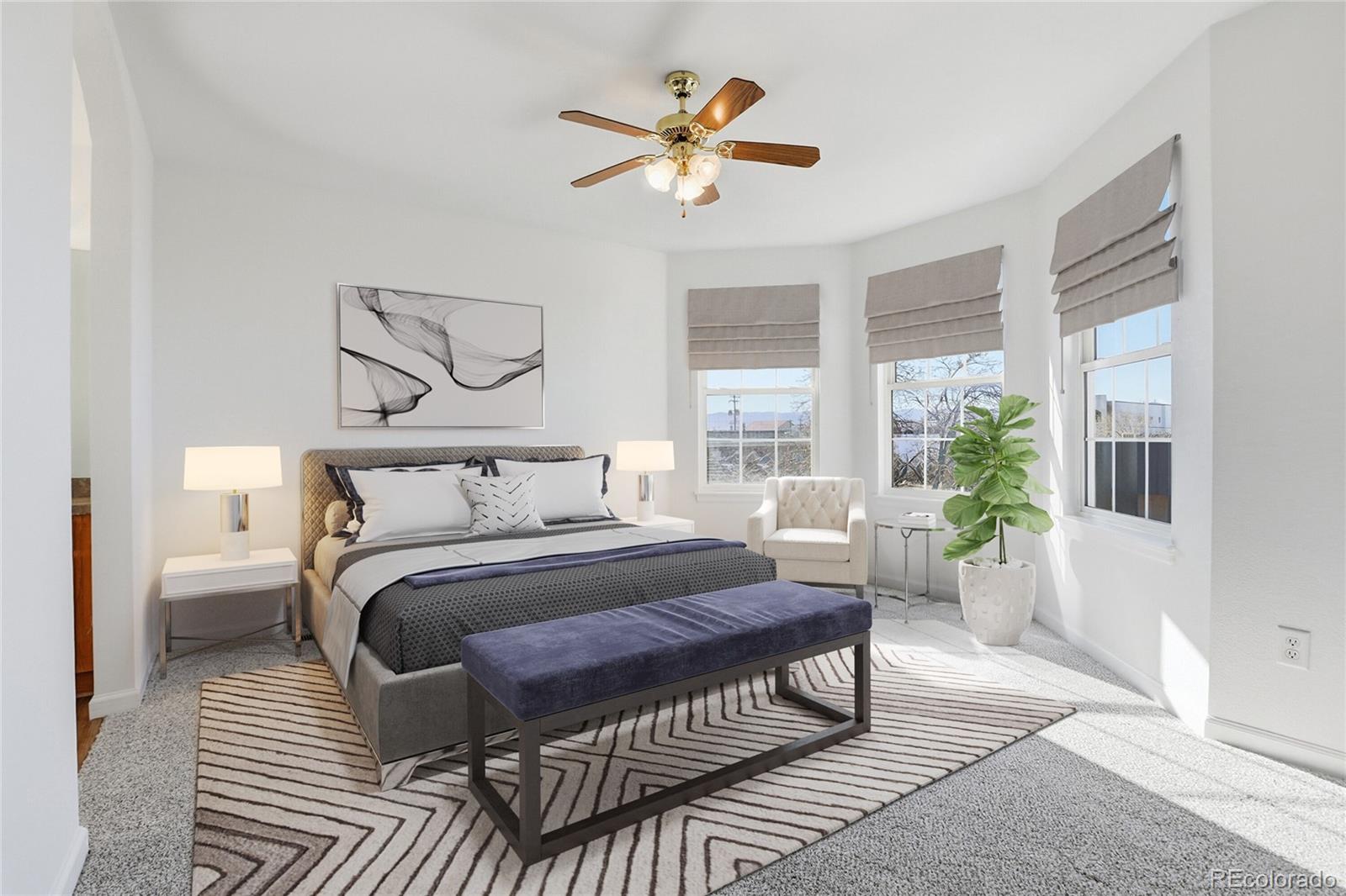 3736 South Inca Street Englewood, CO 80110 - Photo 14 of 31 a bedroom with a large bed a chandelier and a window