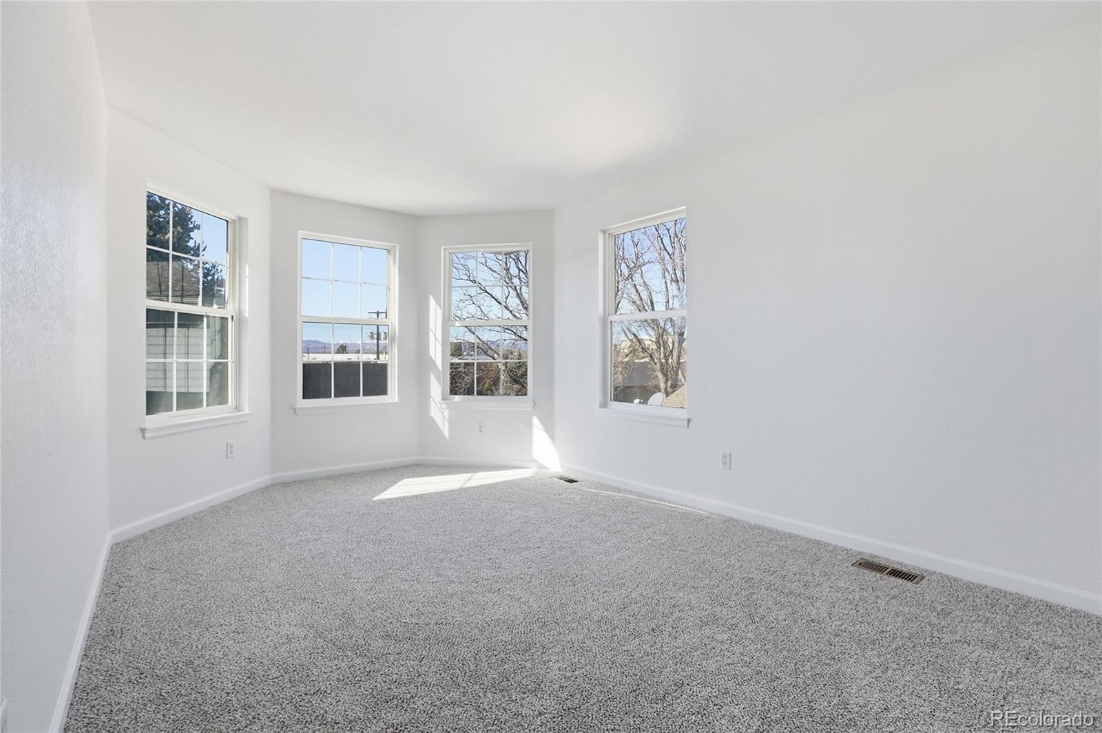 3736 South Inca Street Englewood, CO 80110 - Photo 18 of 31 an empty room with windows
