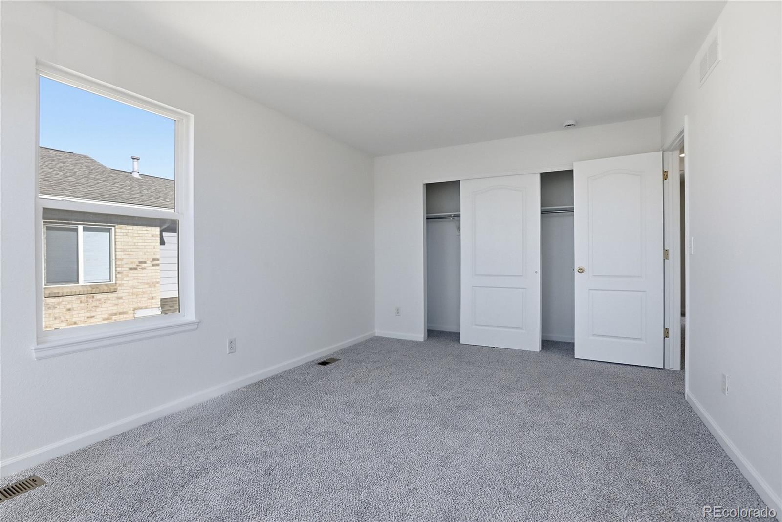 3736 South Inca Street Englewood, CO 80110 - Photo 19 of 31 an empty room with windows and closet