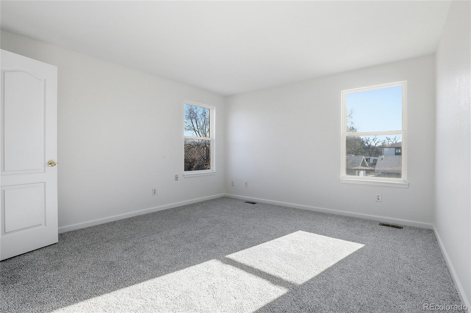 3736 South Inca Street Englewood, CO 80110 - Photo 20 of 31 an empty room with windows