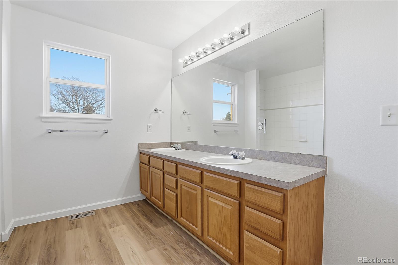3736 South Inca Street Englewood, CO 80110 - Photo 23 of 31 a bathroom with a sink and a mirror