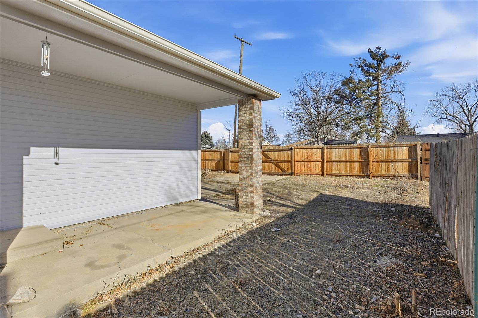 3736 South Inca Street Englewood, CO 80110 - Photo 26 of 31 a view of backyard with wooden fence