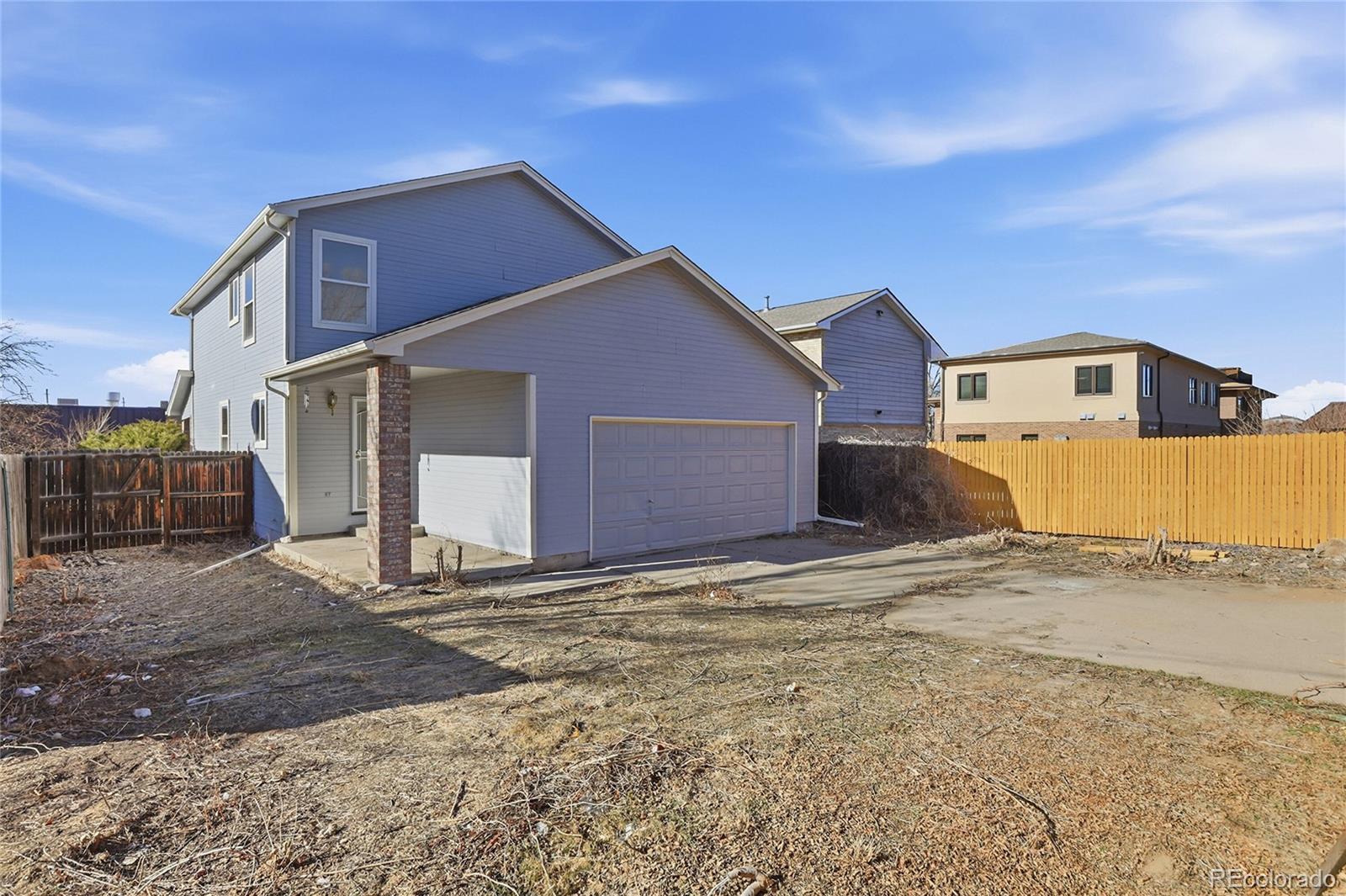 3736 South Inca Street Englewood, CO 80110 - Photo 27 of 31 a front view of a house with a yard