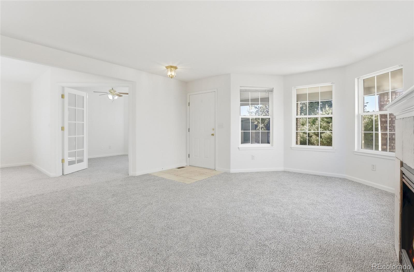 3736 South Inca Street Englewood, CO 80110 - Photo 5 of 31 an empty room with windows