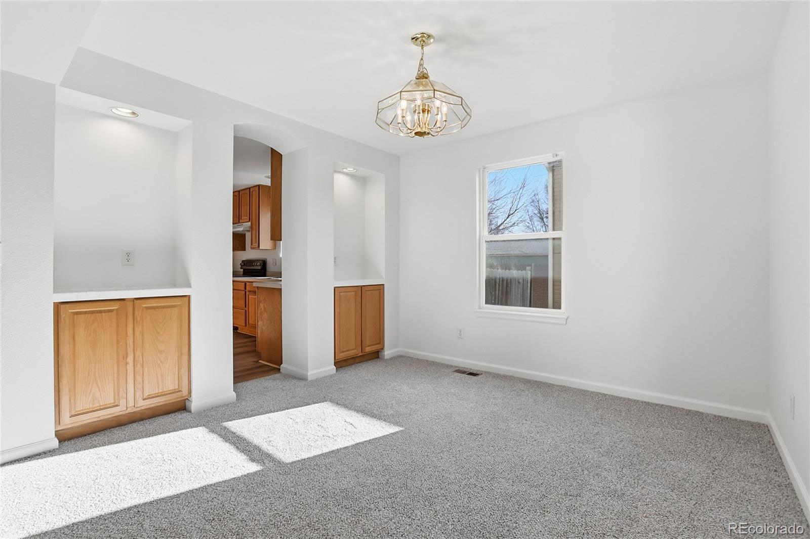 3736 South Inca Street Englewood, CO 80110 - Photo 8 of 31 an empty room with windows and closet