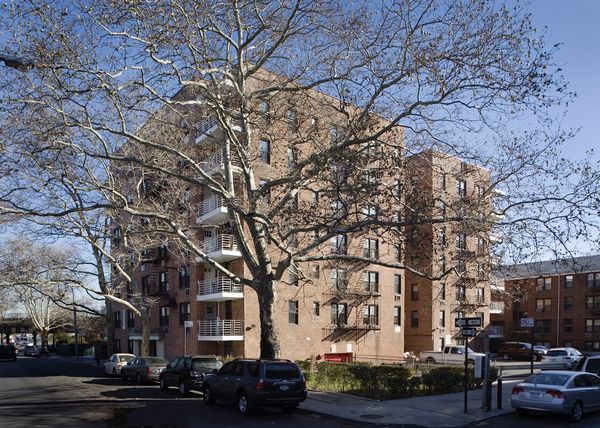 a city street lined with buildings and trees