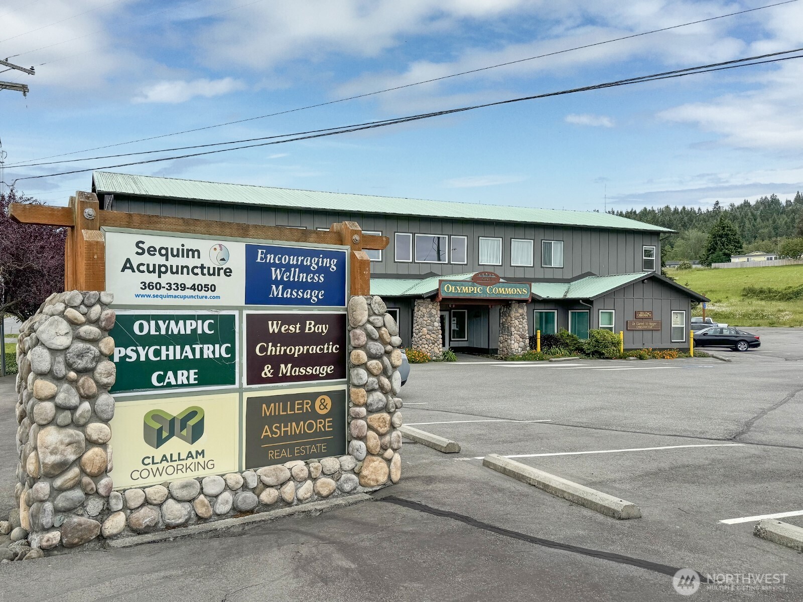 502 South Still Road, Unit 201 Sequim, WA 98382 - Photo 11 of 13 a sign on the side of a building